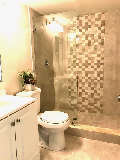 517 Fanshaw M Boca Raton, FL 33434 - Photo 9 of 11 a bathroom with a toilet and a shower