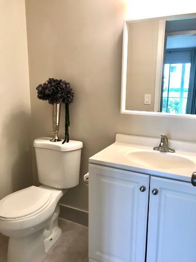 517 Fanshaw M Boca Raton, FL 33434 - Photo 10 of 11 a bathroom with a sink and a toilet