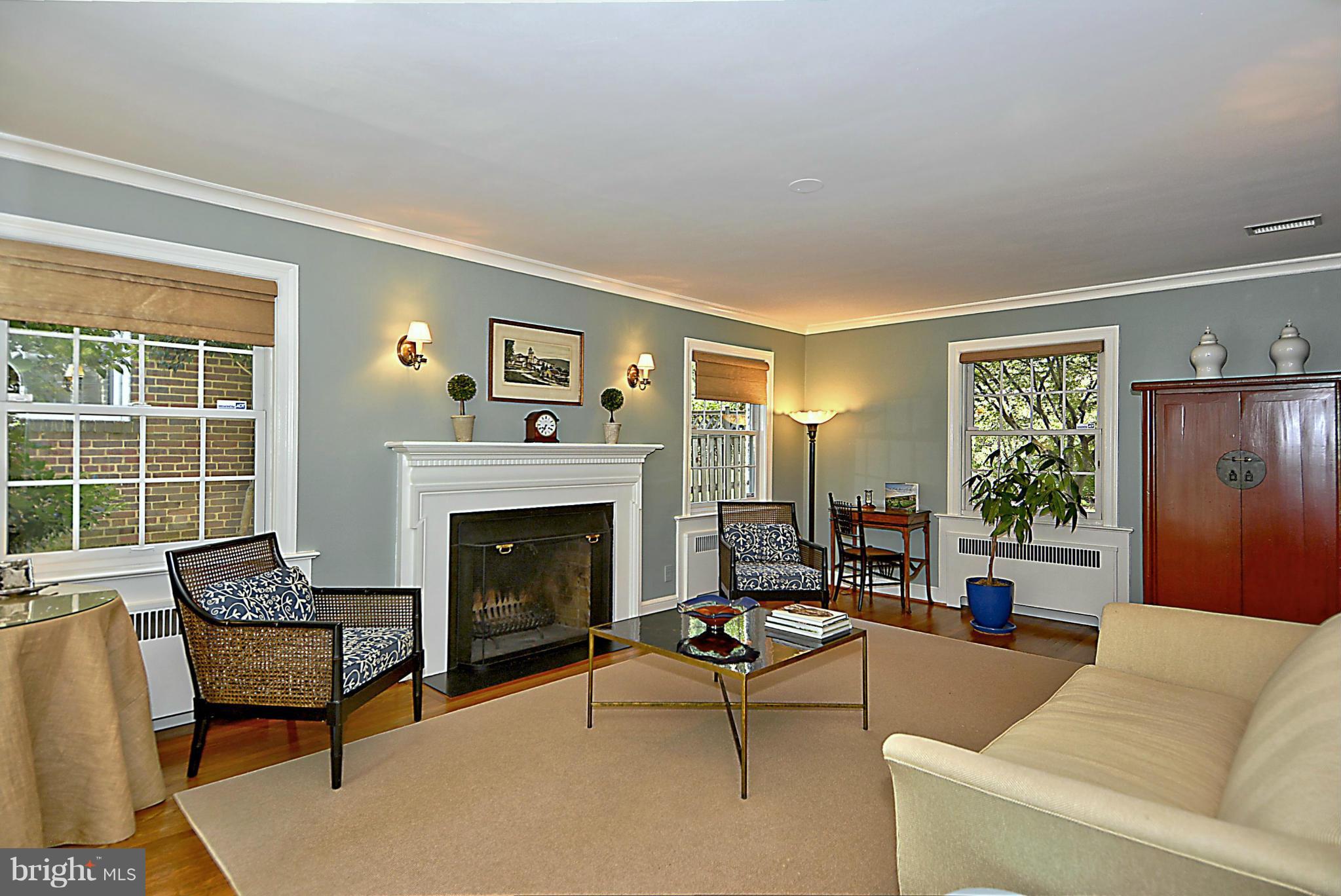 6428 Barnaby Street Northwest Washington, DC 20015 - Photo 6 of 30 Living Room w wood floors & wall sconces