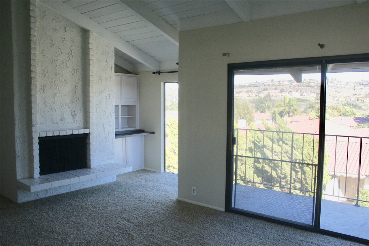 1941 Alga Road, Unit F Carlsbad, CA 92009 - Photo 11 of 22 Master bedroom with fireplace and views!