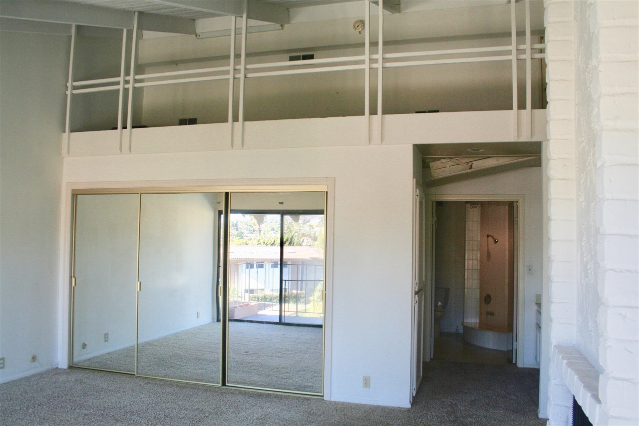 1941 Alga Road, Unit F Carlsbad, CA 92009 - Photo 14 of 22 Master bedroom with loft for storage