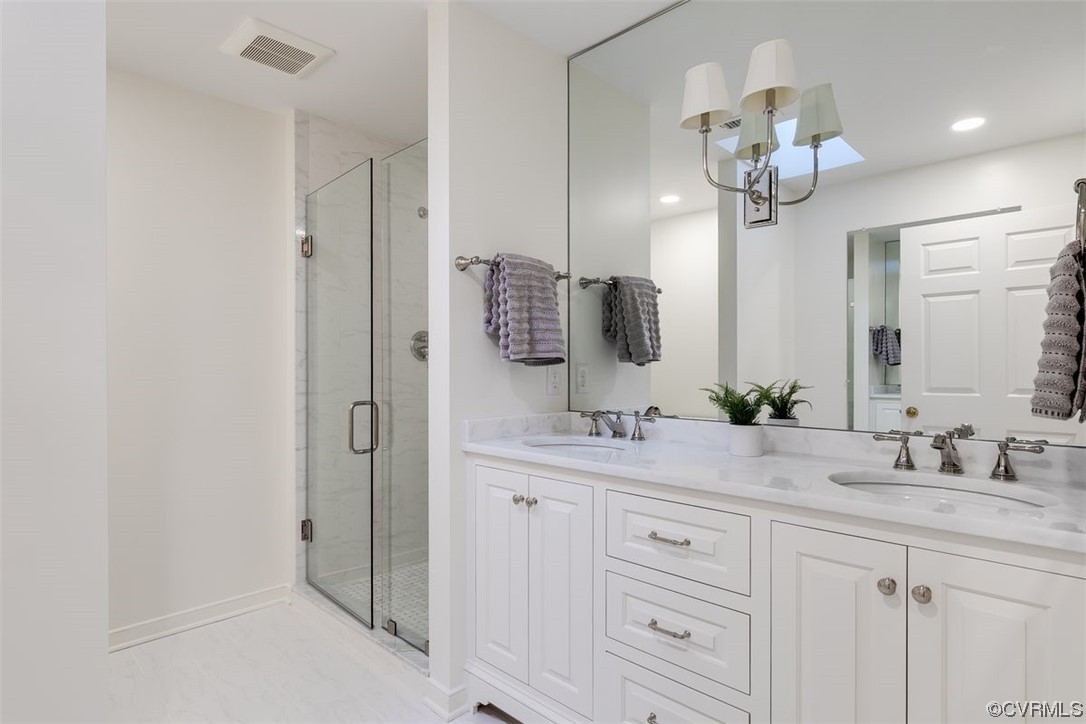 4600 Sulgrave Road Midlothian, VA 23114 - Photo 15 of 26 a bathroom with a double vanity sink and a mirror