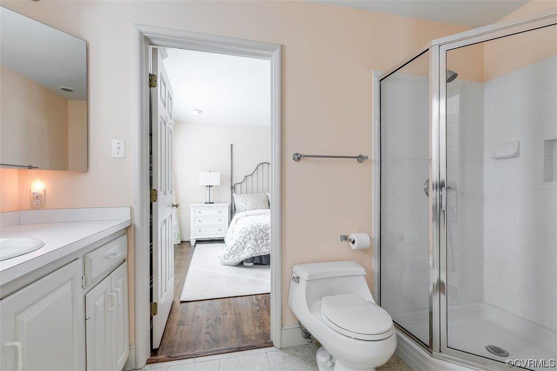 4600 Sulgrave Road Midlothian, VA 23114 - Photo 18 of 26 a bathroom with a granite countertop toilet a sink and shower