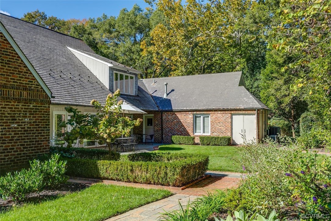 4600 Sulgrave Road Midlothian, VA 23114 - Photo 26 of 26 a view of a house with a yard plants and large tree