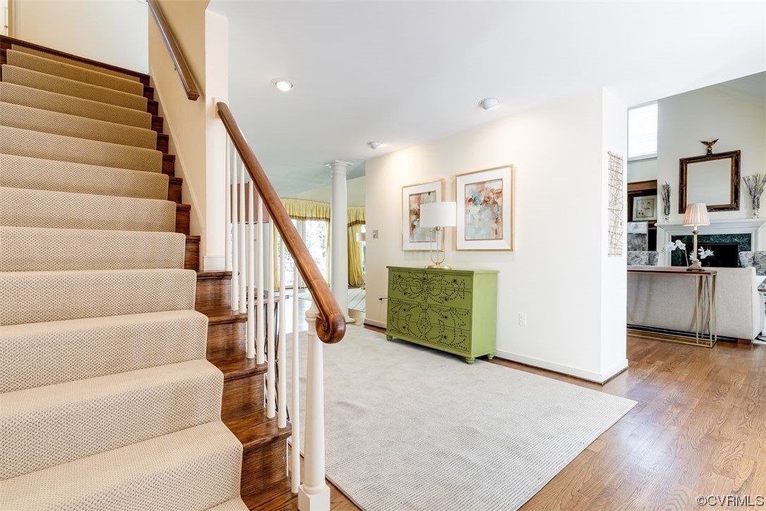 4600 Sulgrave Road Midlothian, VA 23114 - Photo 4 of 26 a view of a hallway with wooden floor and staircase