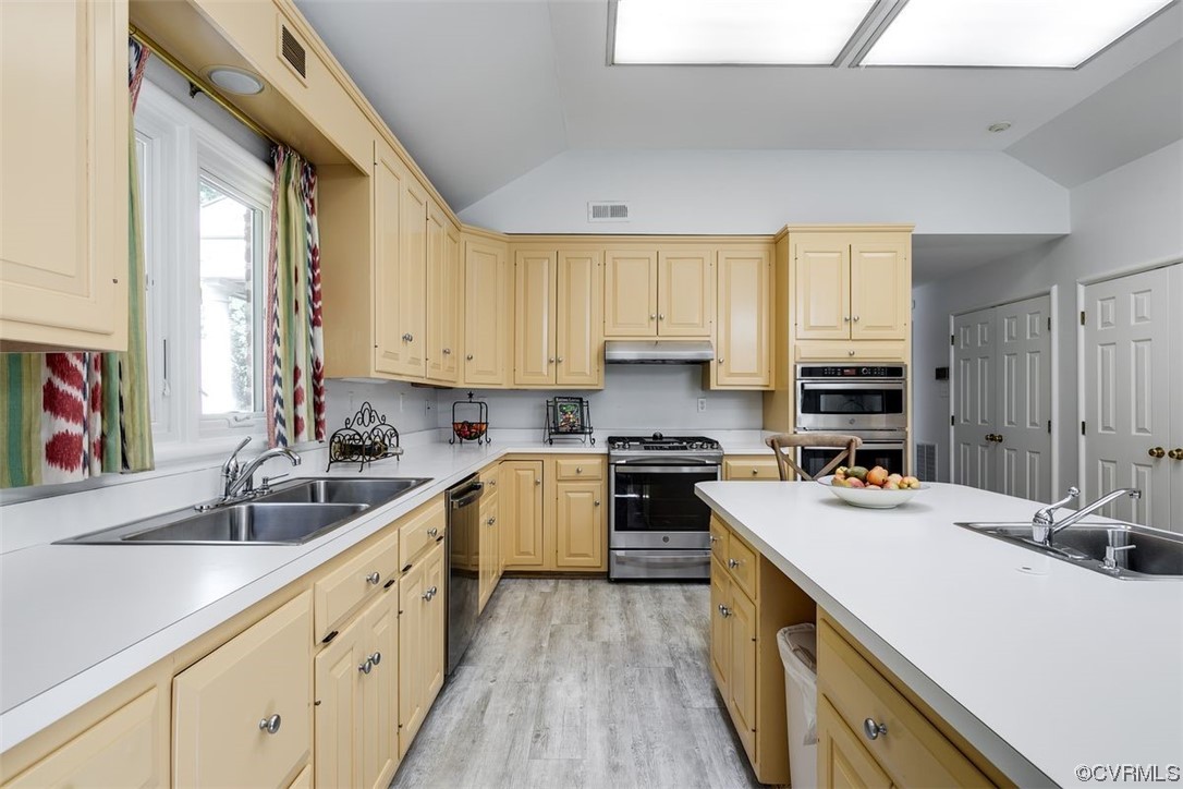 4600 Sulgrave Road Midlothian, VA 23114 - Photo 9 of 26 a kitchen with sink a stove and cabinets