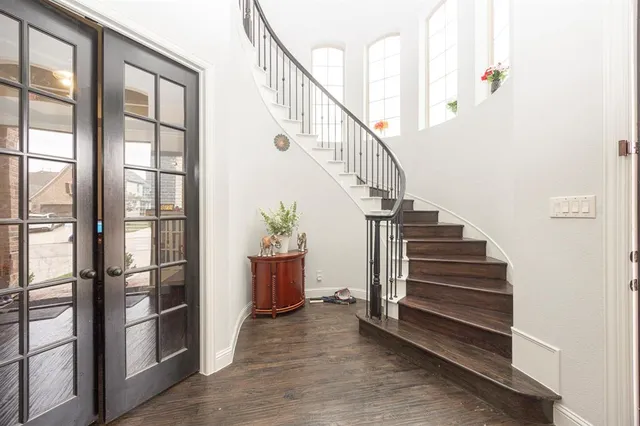 a bedroom with a bed and a chair