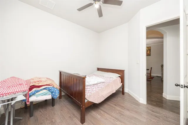a view of a dining room with furniture wooden floor and a chandelier