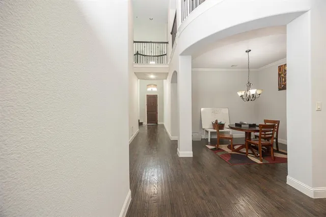 a kitchen with a refrigerator sink and cabinets