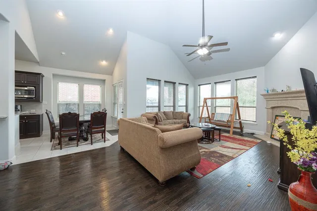 a living room with furniture dining table and a fireplace