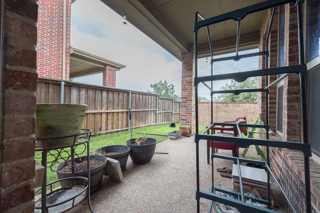 a view of a chairs and table in the patio
