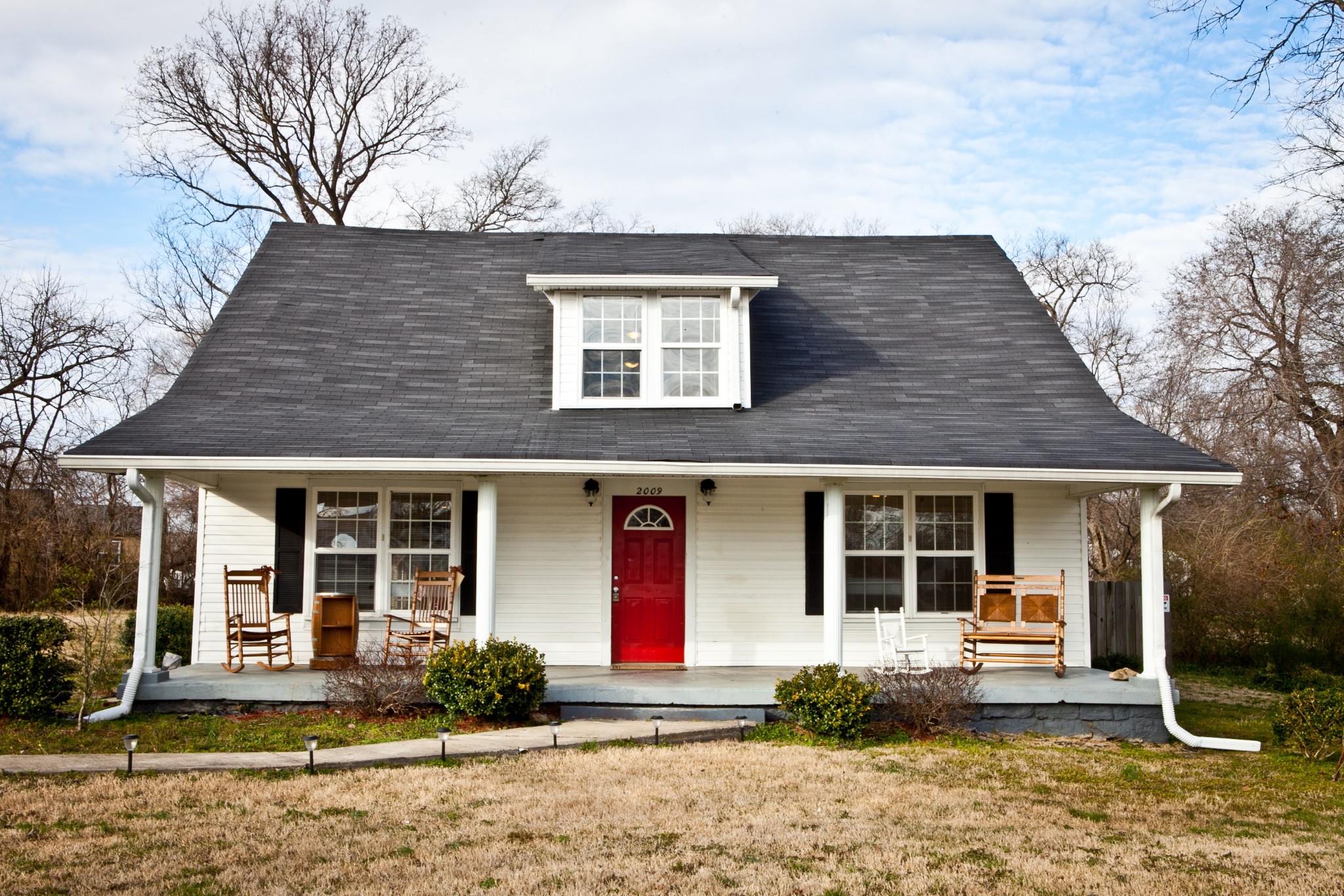 2009 Jones Circle Nashville, TN 37207 - Photo 1 of 18 a front view of a house with a yard and seating space