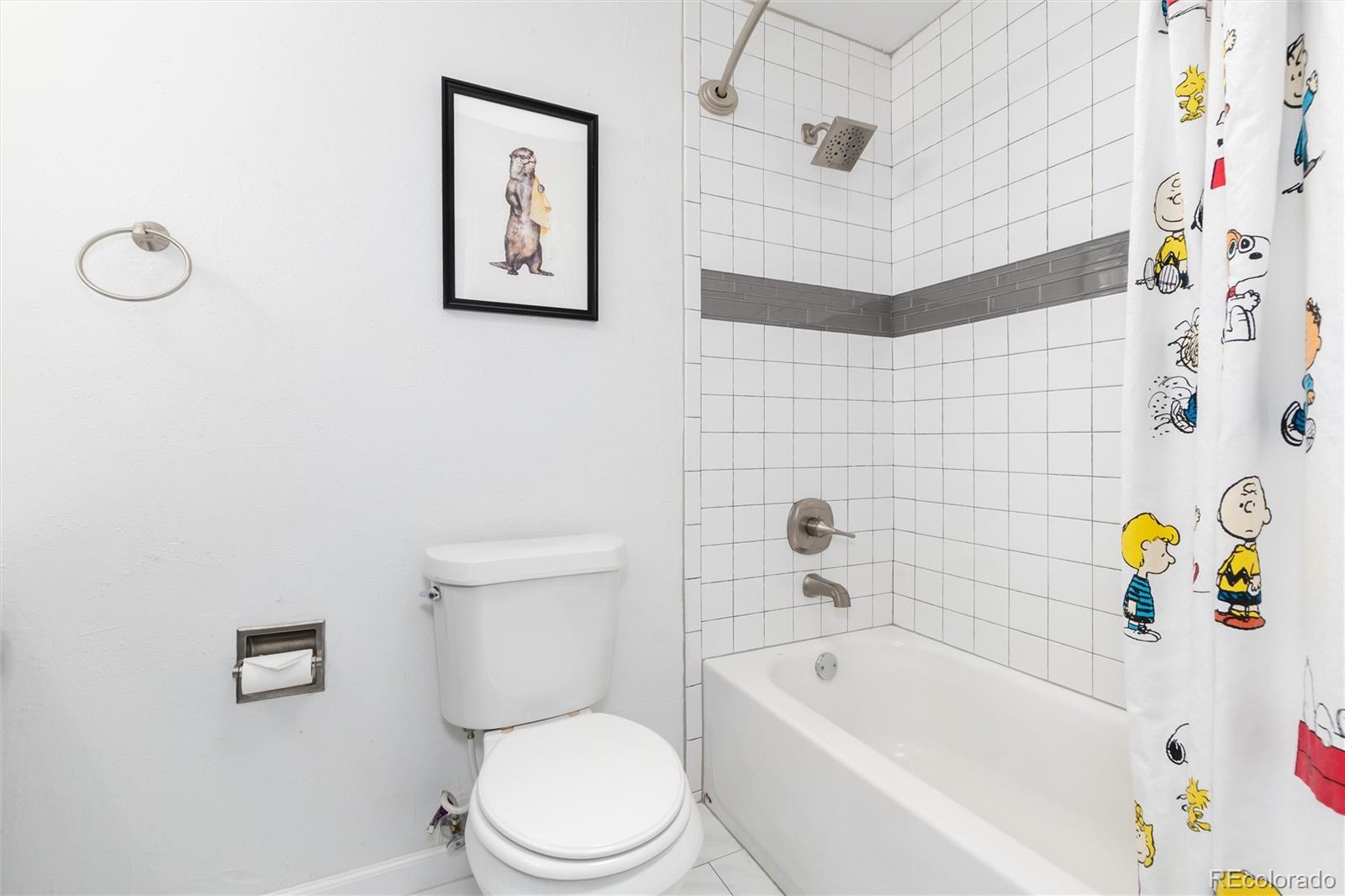 4935 South Routt Street Littleton, CO 80127 - Photo 26 of 45 a bathroom with a toilet sink and bathtub