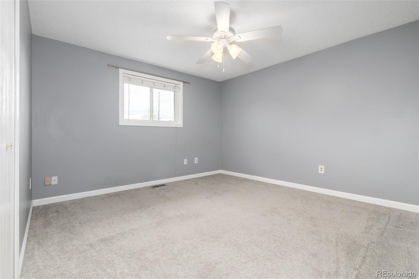 4935 South Routt Street Littleton, CO 80127 - Photo 28 of 45 an empty room with a window