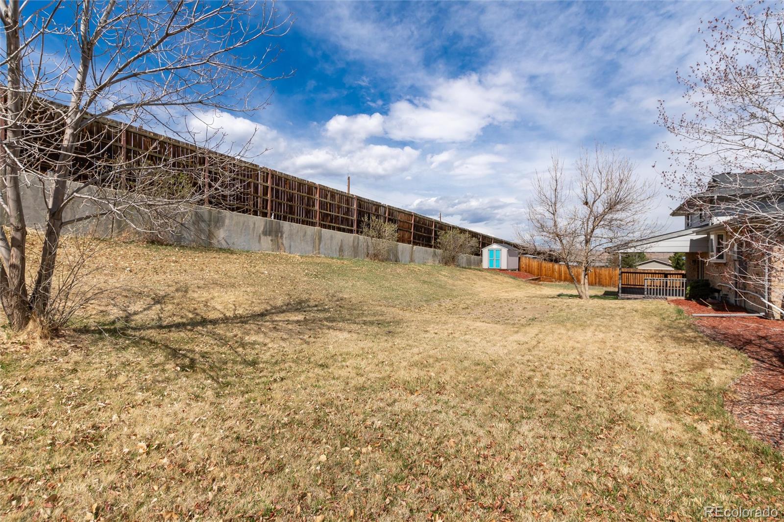 4935 South Routt Street Littleton, CO 80127 - Photo 35 of 45 a view of road with large trees