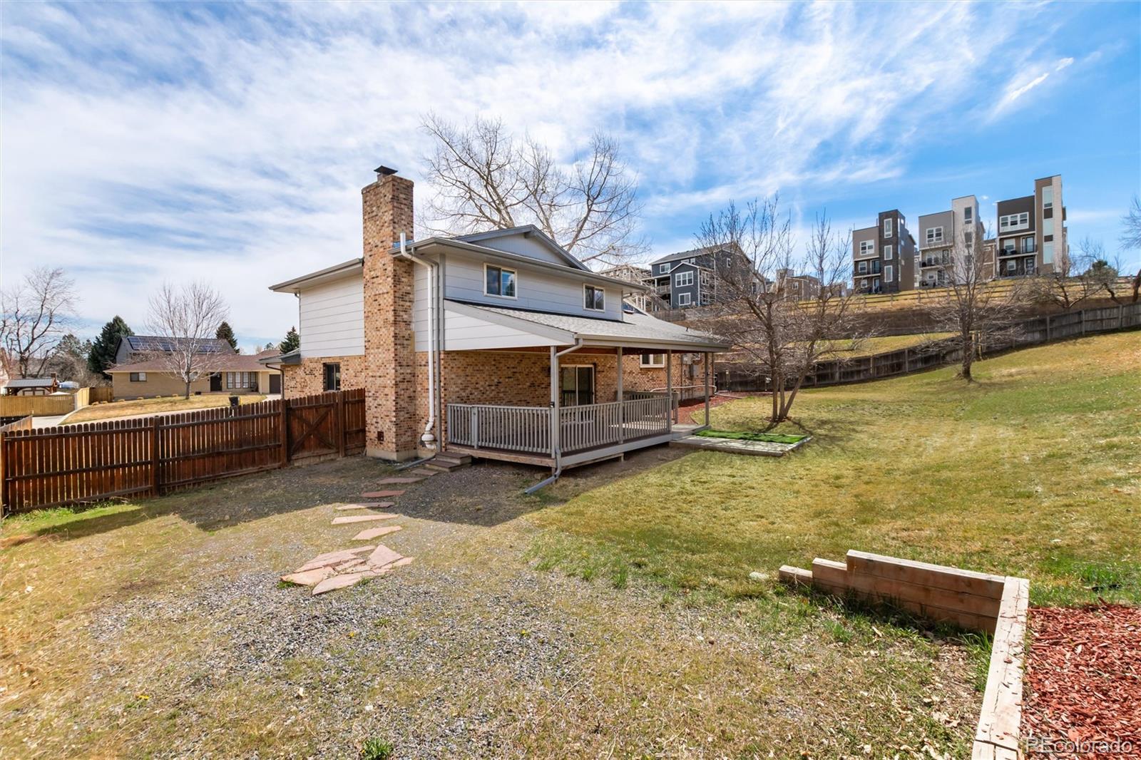 4935 South Routt Street Littleton, CO 80127 - Photo 39 of 45 a view of a lake with a house