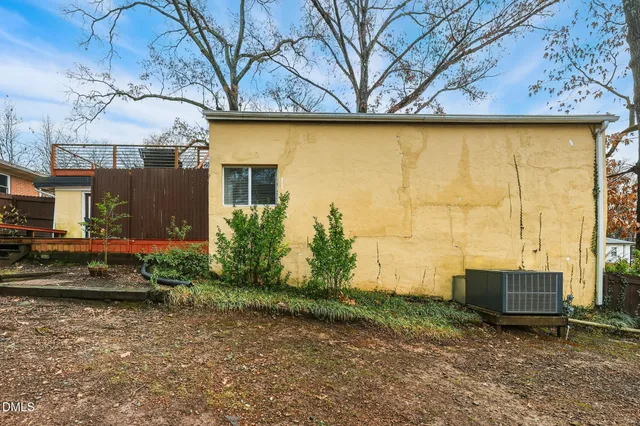 a view of a house with a tree