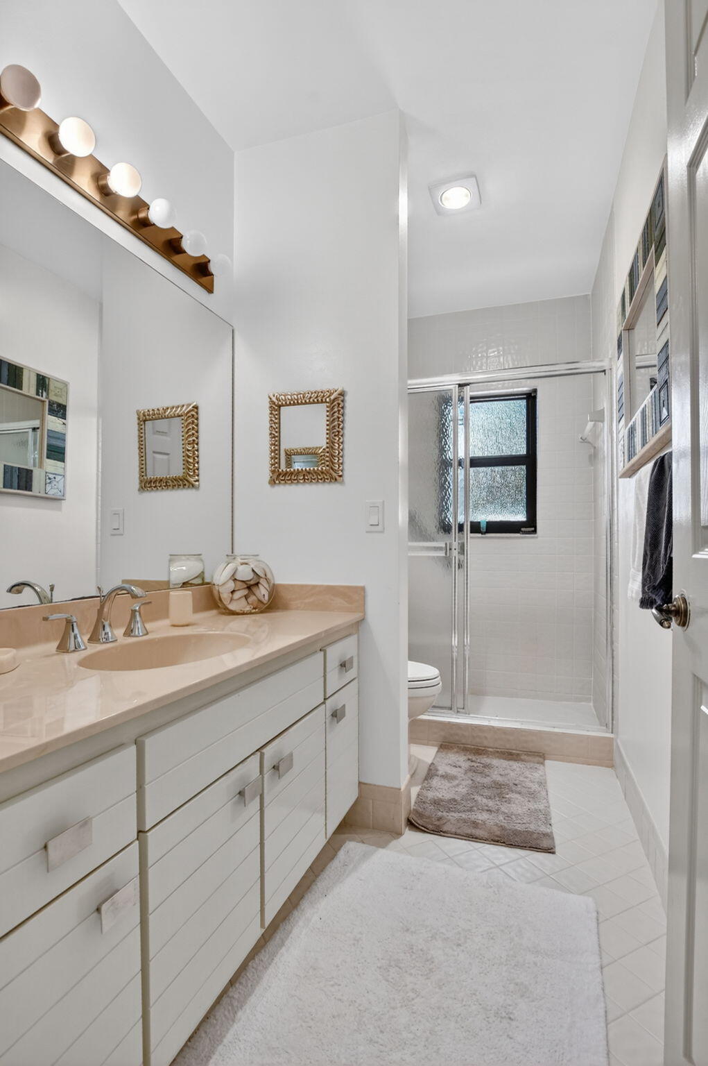 22519 Esplanada Circle, Unit W Boca Raton, FL 33433 - Photo 42 of 57 a spacious bathroom with a granite countertop sink a mirror and a