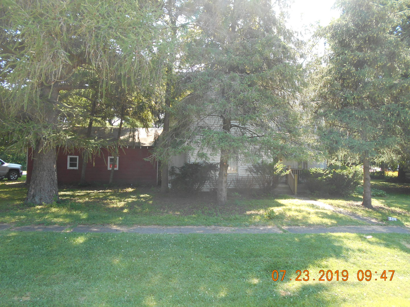 208 North 1st Street Ridge Farm, IL 61870 - Photo 1 of 23 a backyard of a house with lots of green space