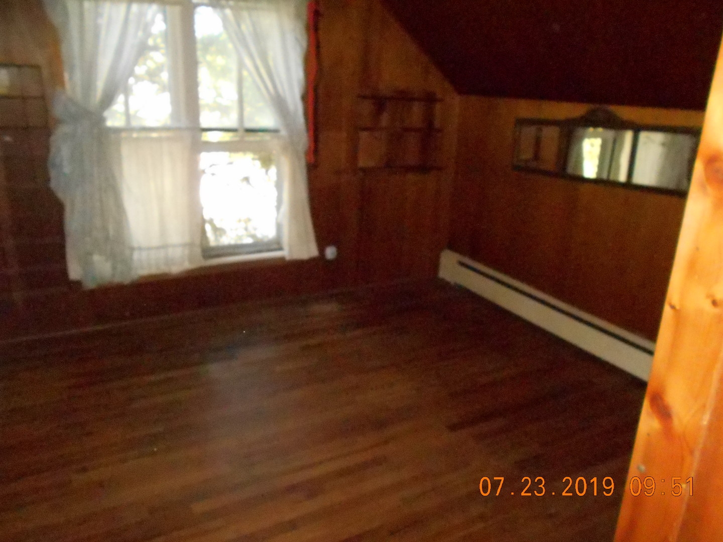 208 North 1st Street Ridge Farm, IL 61870 - Photo 14 of 23 an empty room with wooden floor and windows