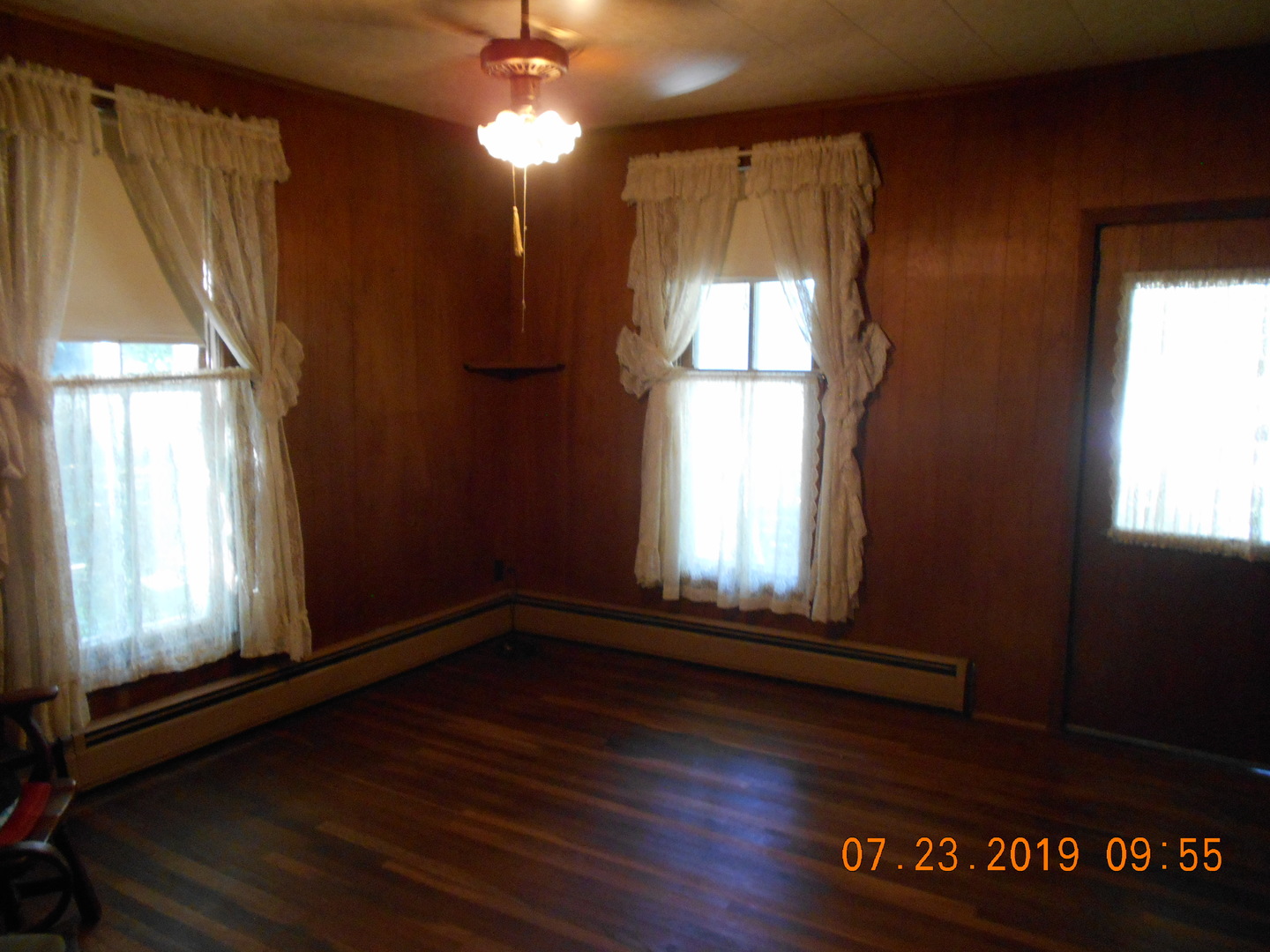 208 North 1st Street Ridge Farm, IL 61870 - Photo 22 of 23 a view of an empty room with wooden floor and a window