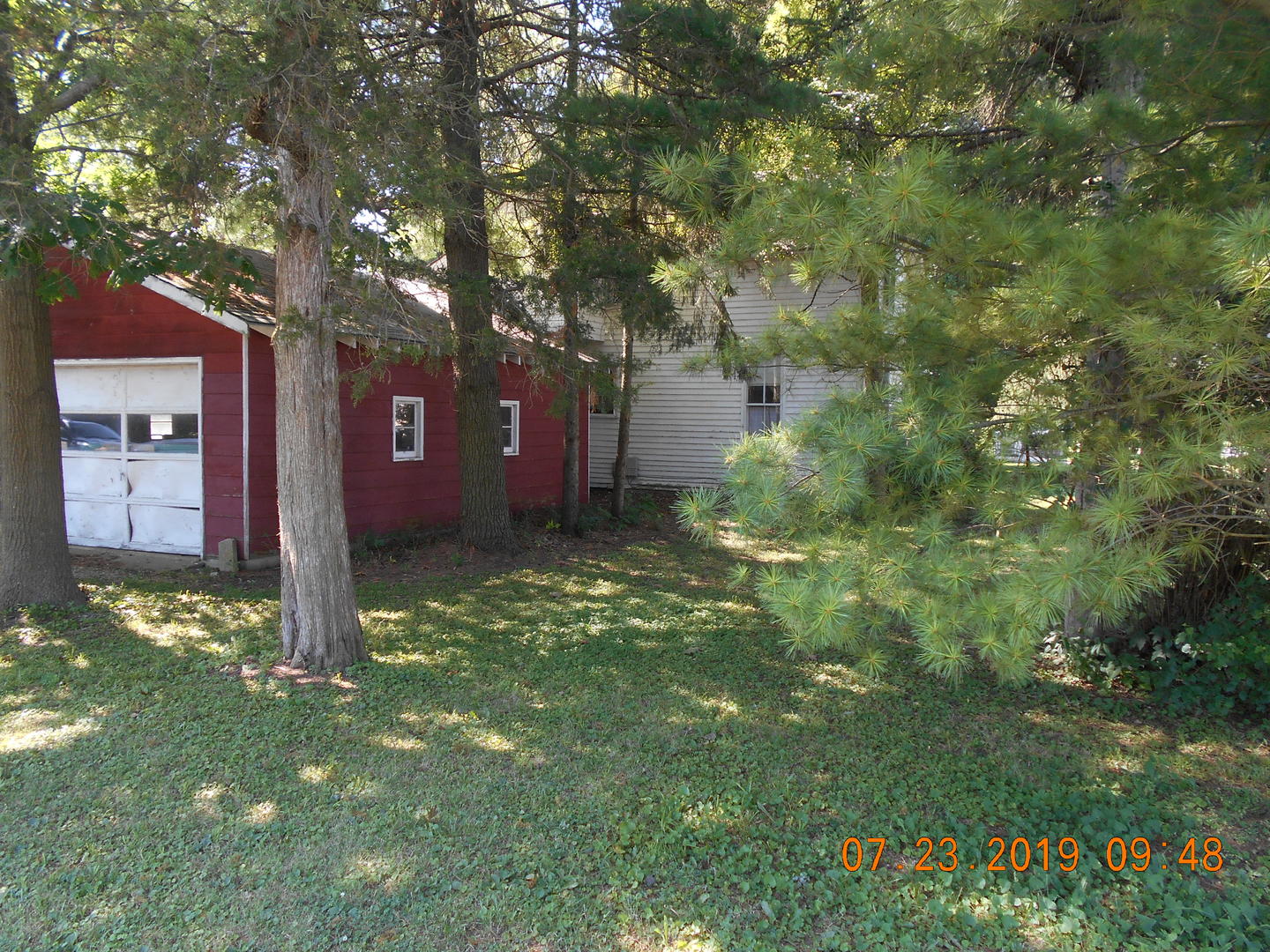 208 North 1st Street Ridge Farm, IL 61870 - Photo 4 of 23 a view of a large tree in front of a house