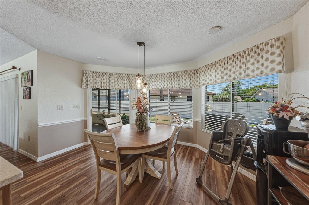 7435 Kilbride Court Weeki Wachee, FL 34613 - Photo 12 of 67 a view of a dining room with furniture window and outside view