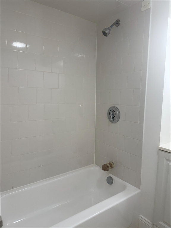 104 Beacon Street, Unit 1A Chelsea, MA 02150 - Photo 6 of 9 a bathroom with a bathtub