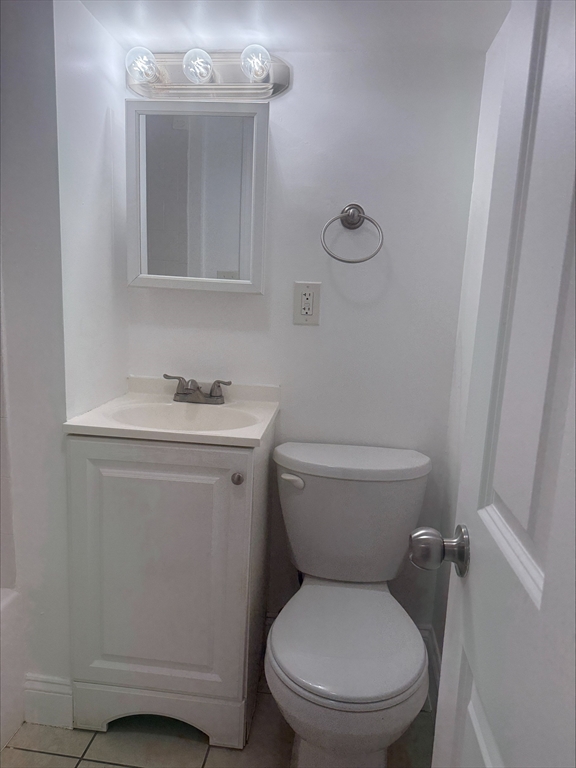 104 Beacon Street, Unit 1A Chelsea, MA 02150 - Photo 9 of 9 a white toilet sitting next to a bathroom sink