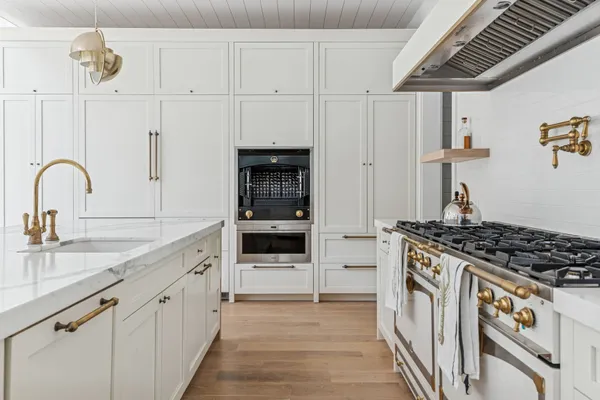 a bathroom with a bathtub and next to a window