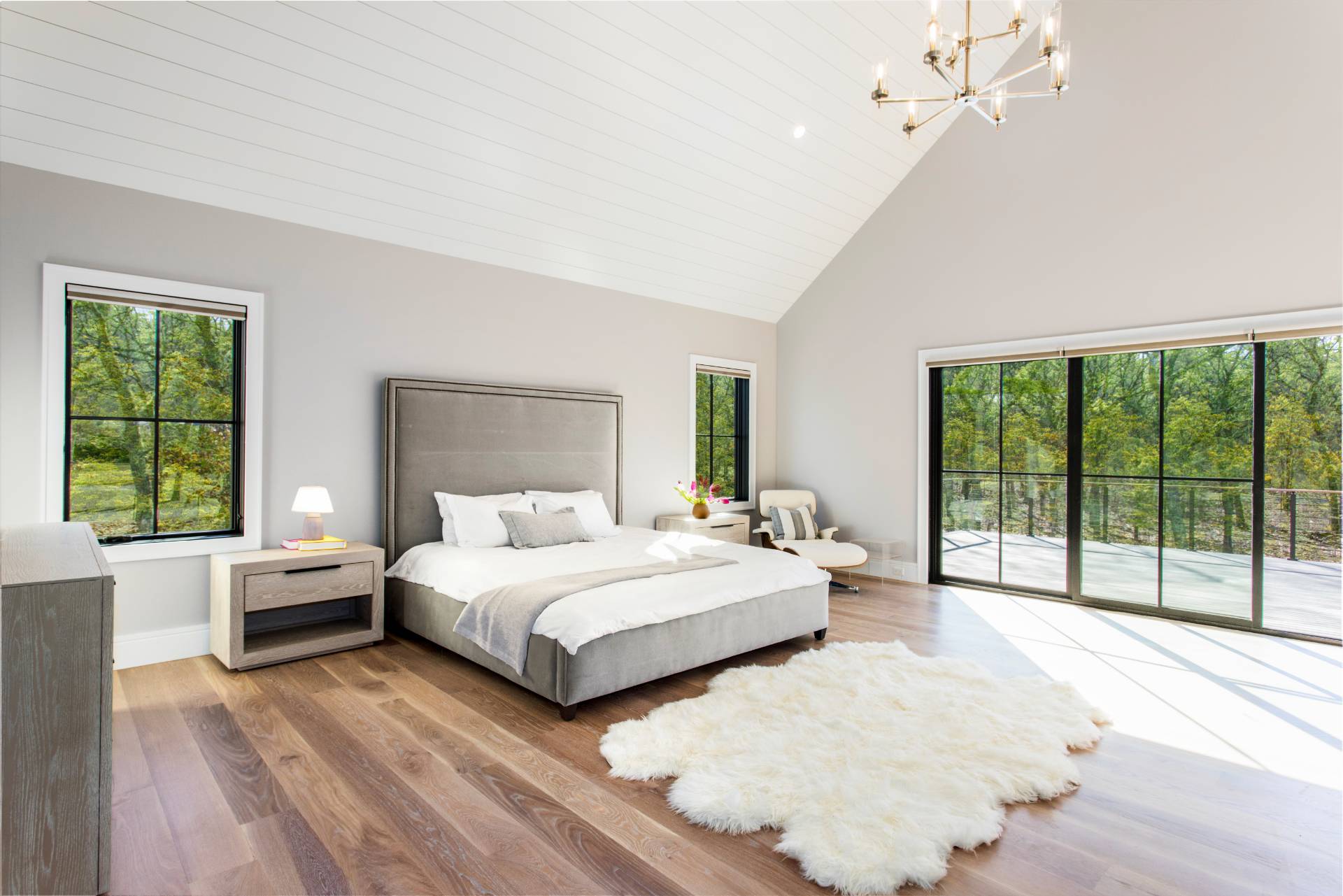 780 Sagg Road Sagaponack, NY 11962 - Photo 20 of 47 a bedroom with a large bed and a large window