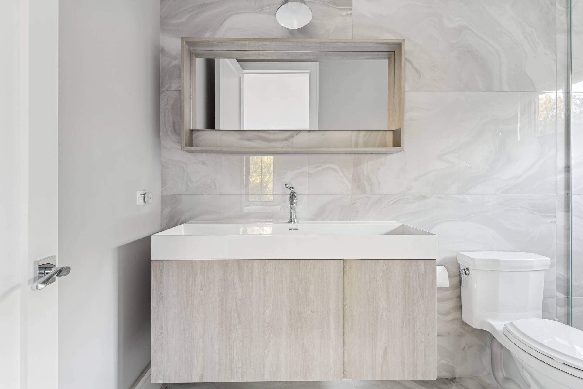 780 Sagg Road Sagaponack, NY 11962 - Photo 30 of 47 a bathroom with a sink a toilet and mirror