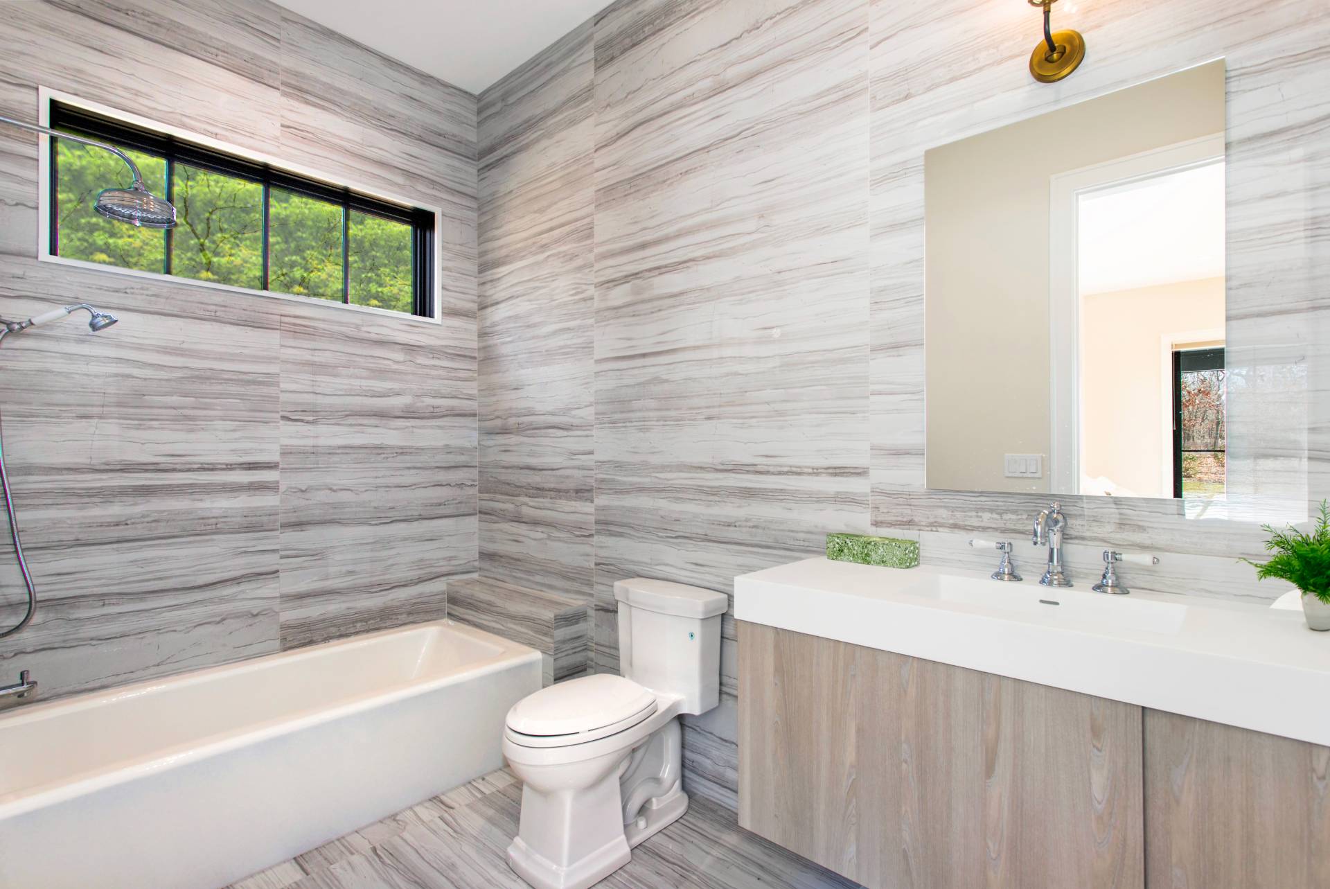 780 Sagg Road Sagaponack, NY 11962 - Photo 36 of 47 a bathroom with a sink a toilet and bathtub