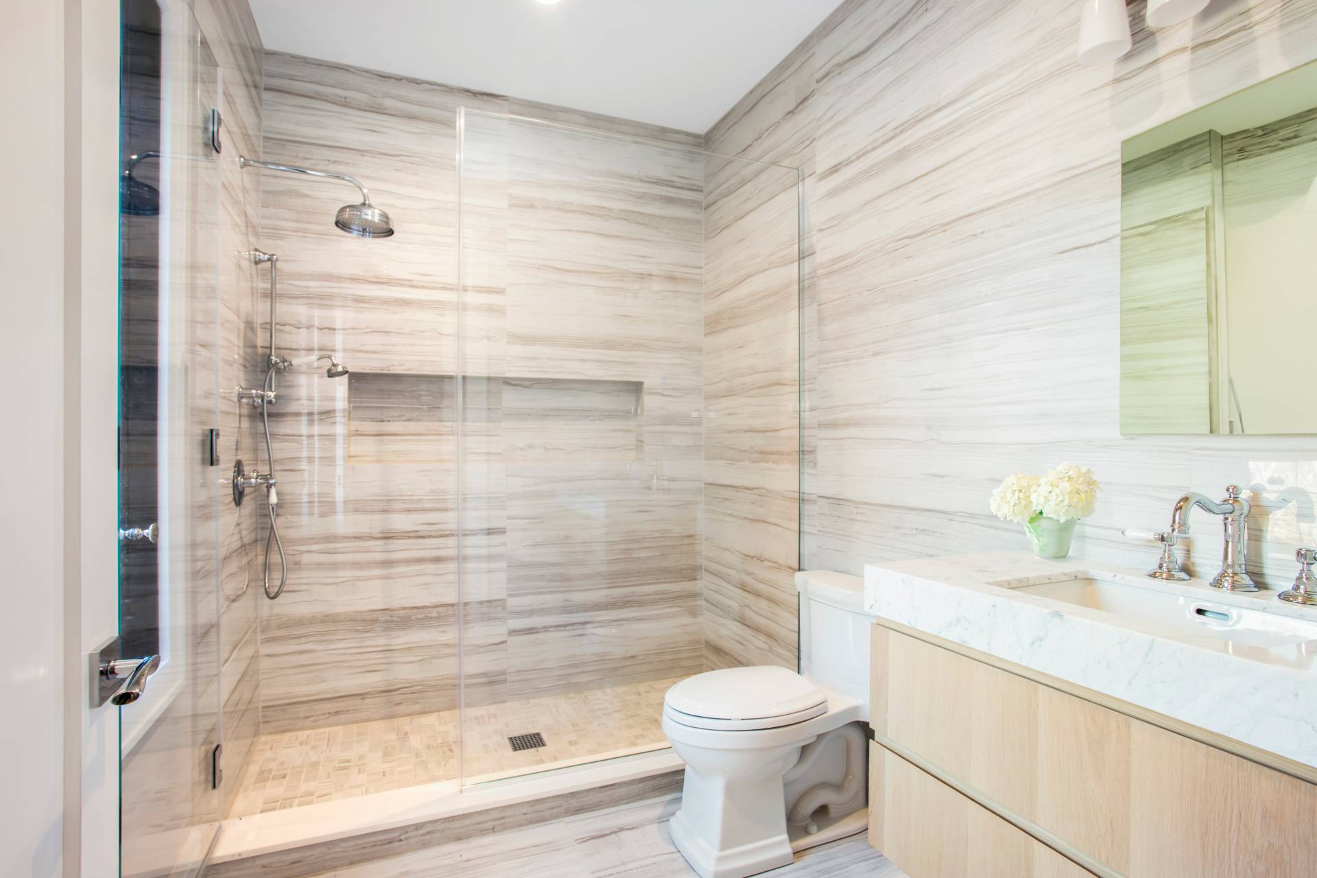 780 Sagg Road Sagaponack, NY 11962 - Photo 39 of 47 a bathroom with a bathtub shower sink vanity and toilet