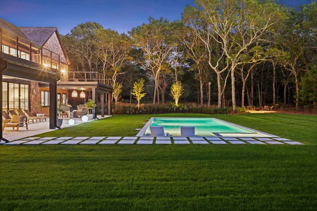 a view of house with a yard