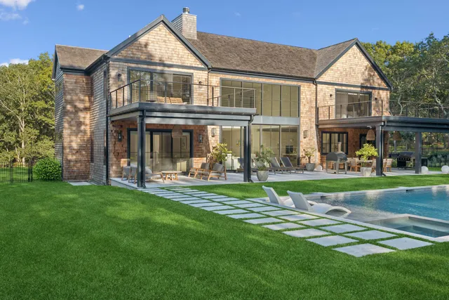 a kitchen with cabinets and wooden floor
