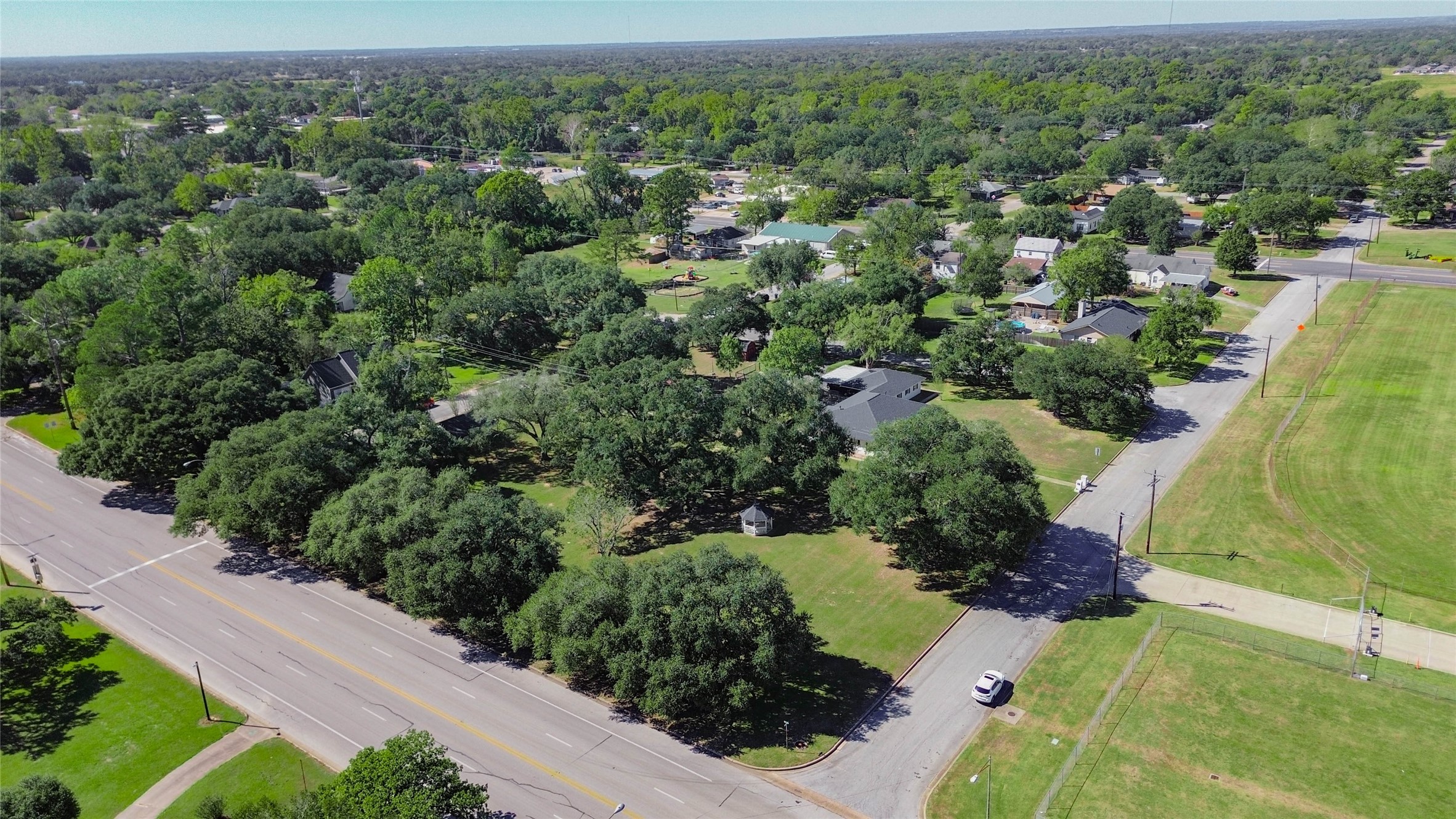 6-7 11th Street Hempstead, TX 77445 - Photo 8 of 10 an aerial view of a house with a yard