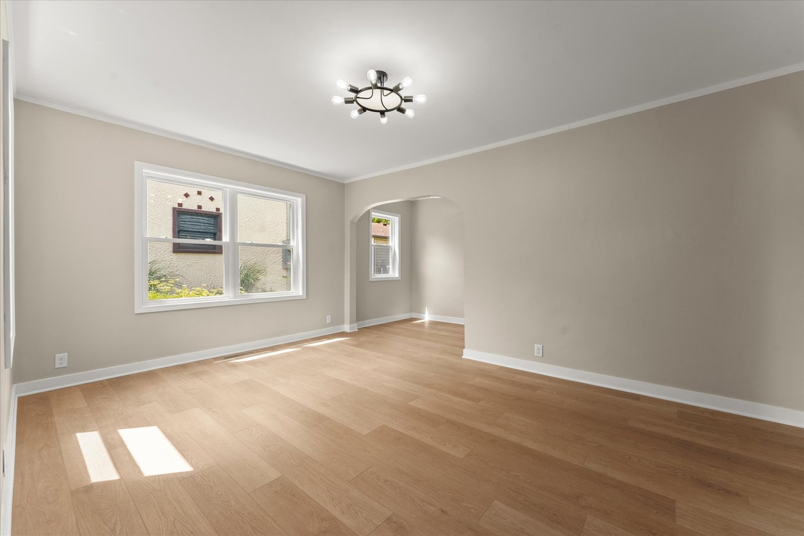 305 South Fair Street Champaign, IL 61821 - Photo 6 of 41 a view of an empty room with a window and wooden floor