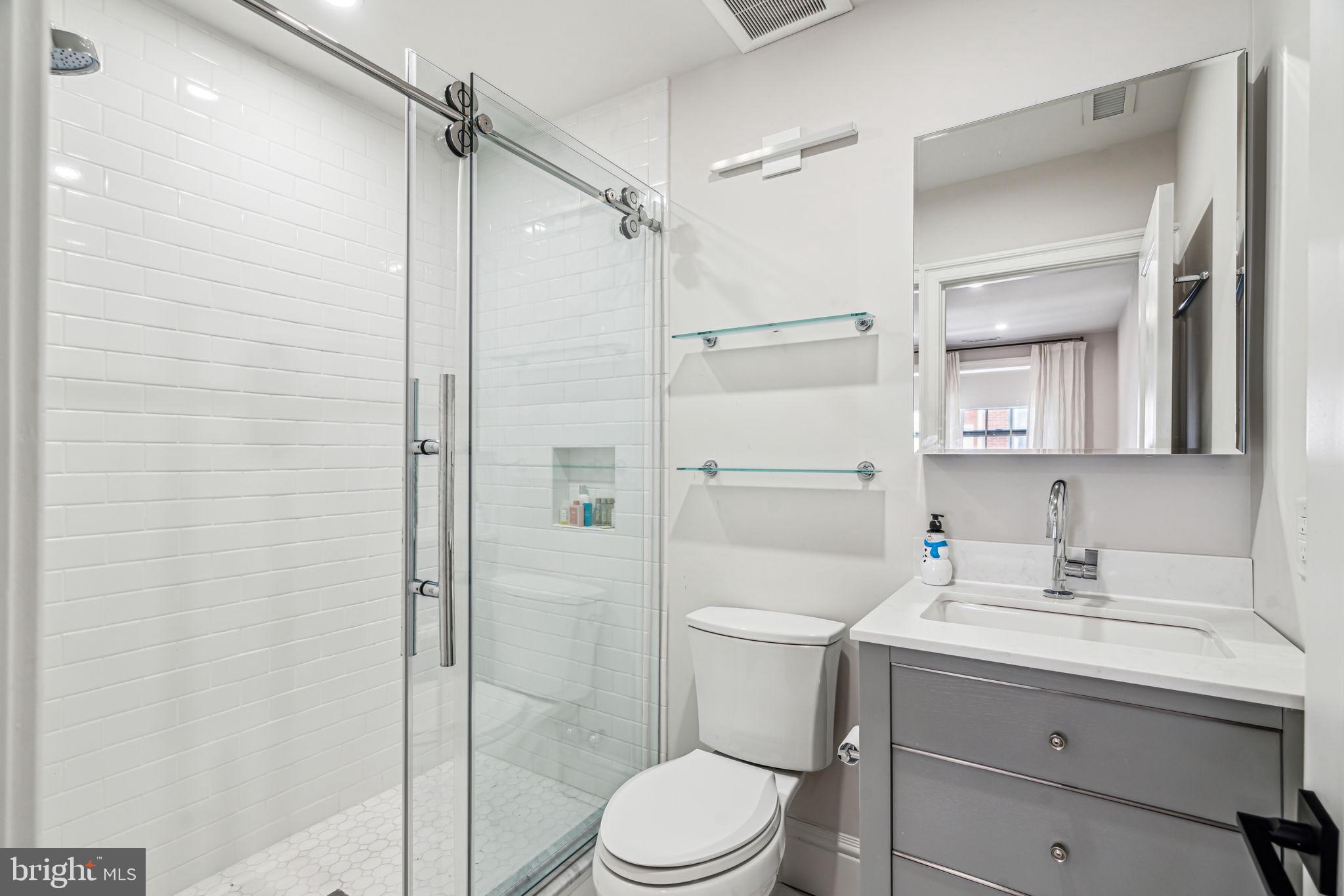 1710 Rittenhouse Square Philadelphia, PA 19103 - Photo 22 of 28 a bathroom with a sink a toilet and shower