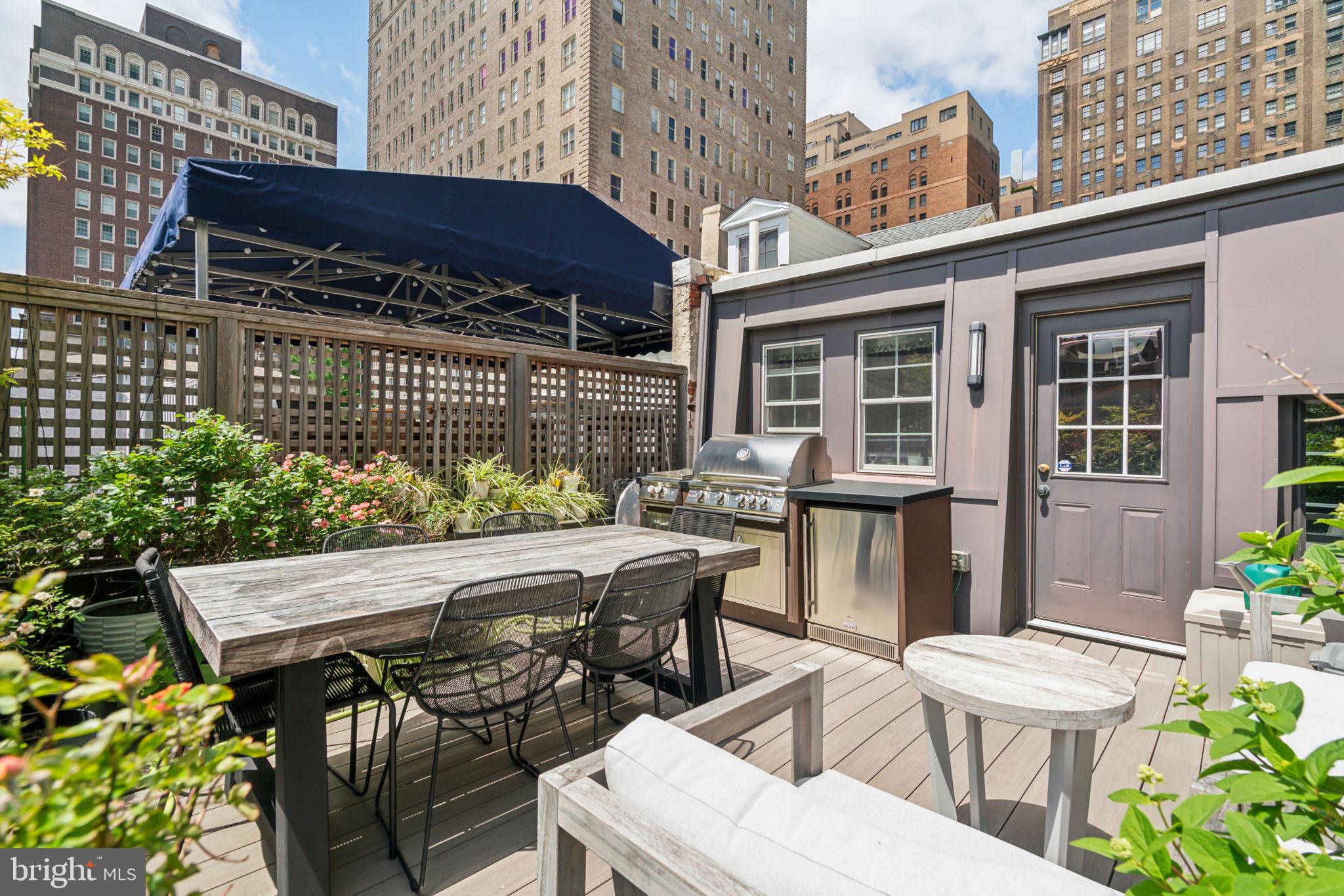 1710 Rittenhouse Square Philadelphia, PA 19103 - Photo 27 of 28 a view of a patio with table and chairs and potted plants