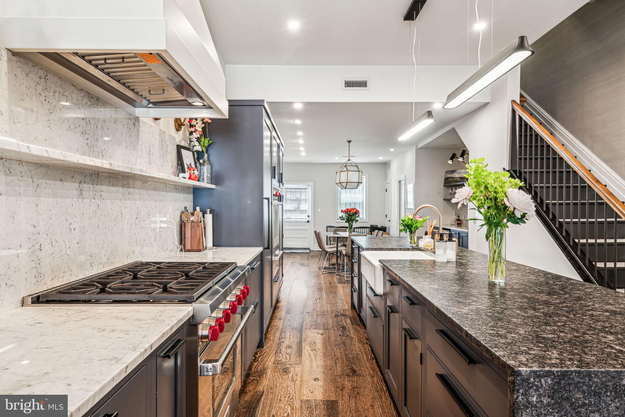1710 Rittenhouse Square Philadelphia, PA 19103 - Photo 7 of 28 a kitchen with sink stove and cabinets