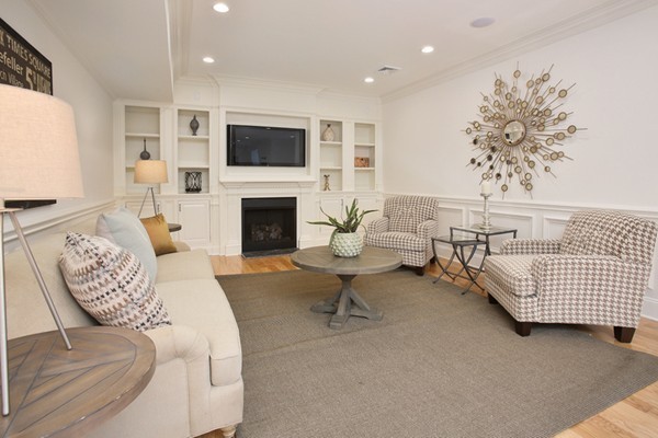 33 Sherbrooke Road Newton, MA 02458 - Photo 14 of 18 a living room with furniture fireplace and a flat screen tv