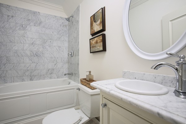 33 Sherbrooke Road Newton, MA 02458 - Photo 6 of 18 a bathroom with a granite countertop toilet sink and mirror