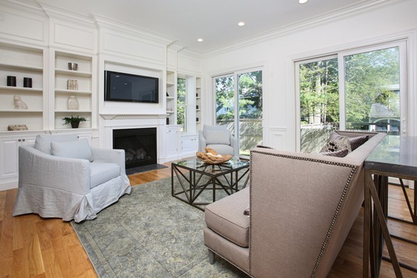 33 Sherbrooke Road Newton, MA 02458 - Photo 8 of 18 a living room with furniture a flat screen tv and a fireplace