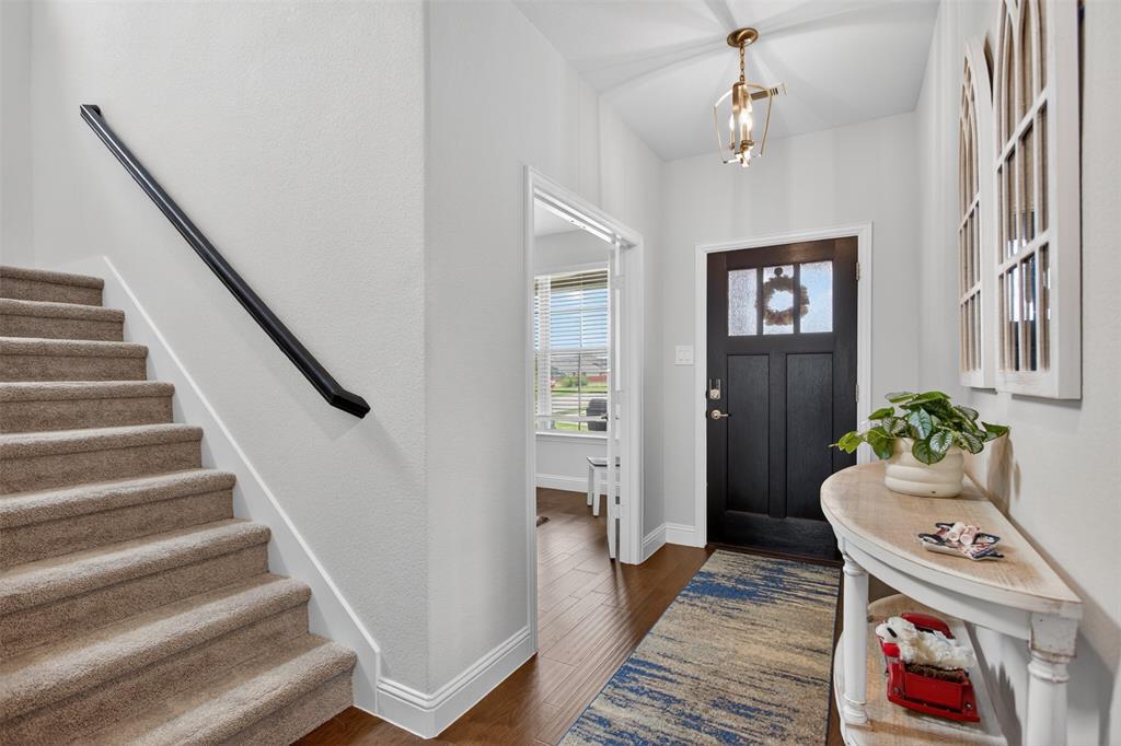 1002 Coppersmith Way Forney, TX 75126 - Photo 10 of 39 a view of an entryway with wooden floor
