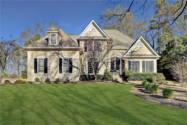 a front view of a house with a yard