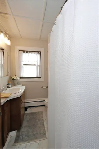 a bathroom with sink and mirror