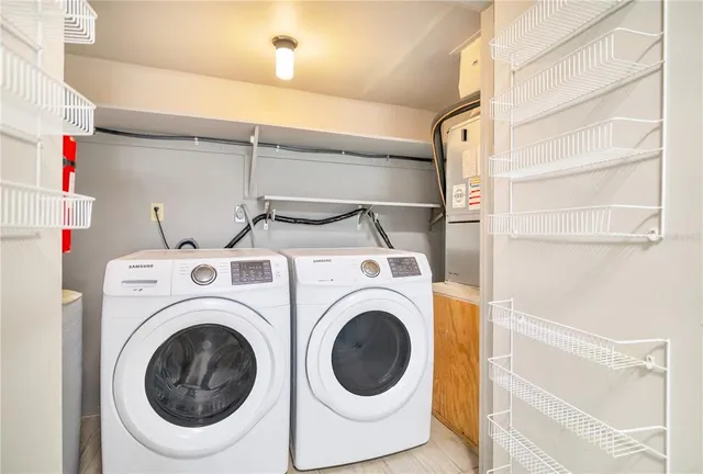 a utility room with dryer and washer