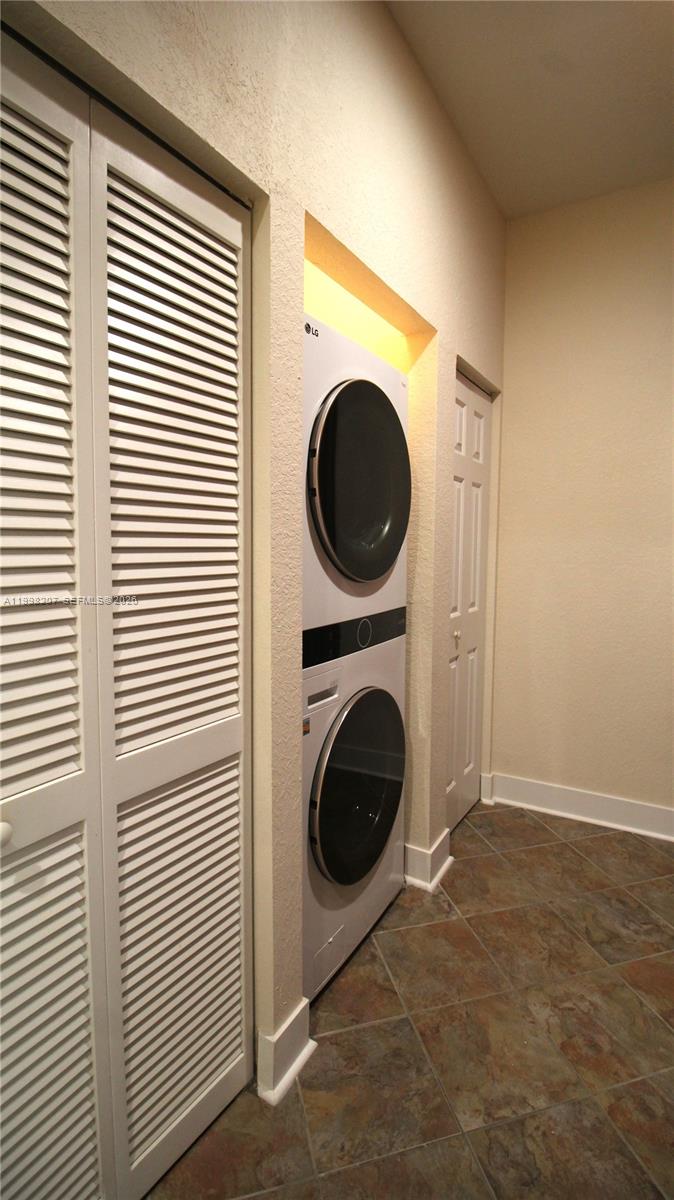 3377 Merrick Lane, Unit 707 Margate, FL 33063 - Photo 20 of 33 a utility room with dryer and washer