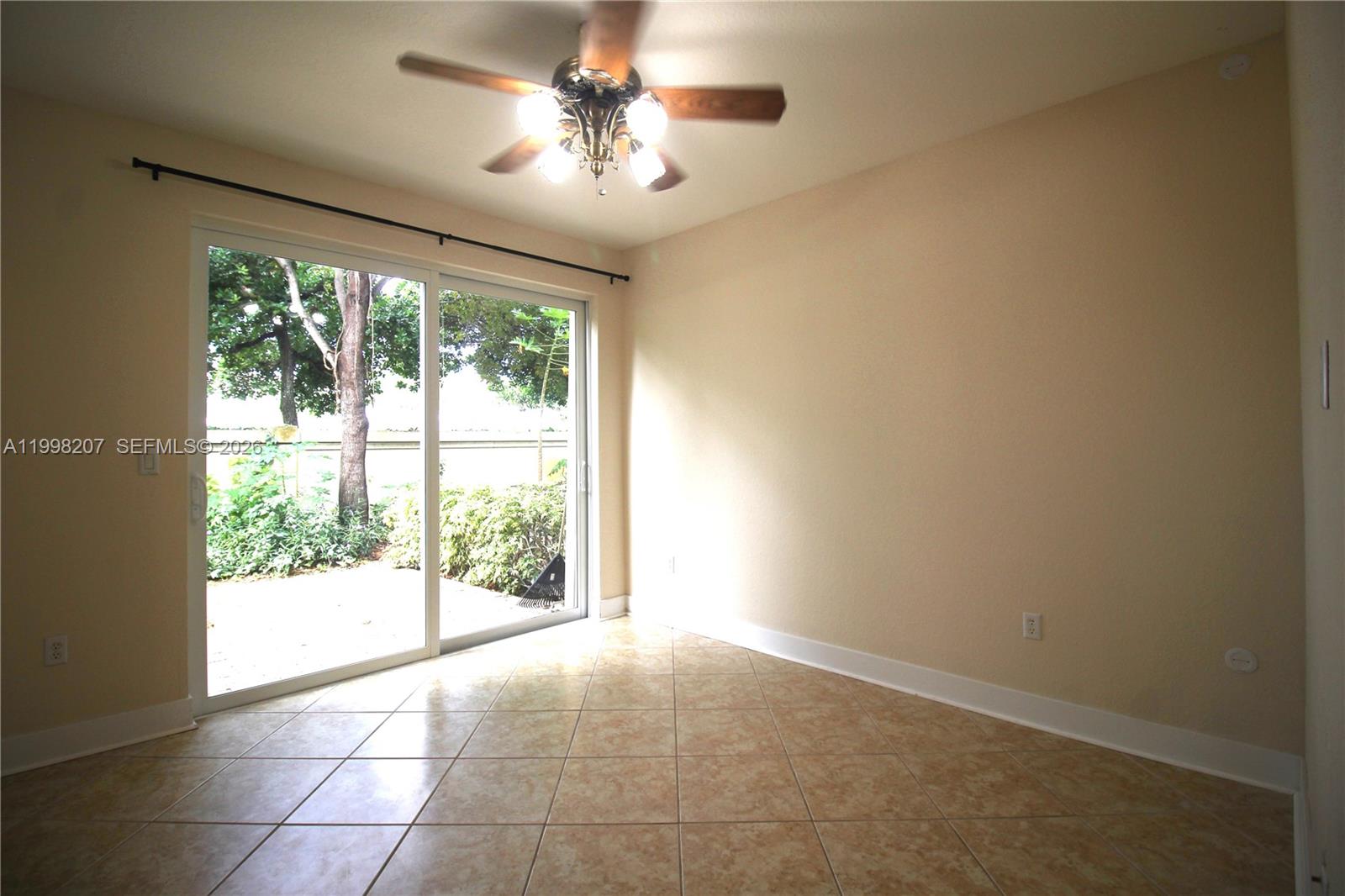 3377 Merrick Lane, Unit 707 Margate, FL 33063 - Photo 7 of 33 a view of an empty room with a window